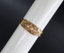 A Victorian 15ct gold mourning ring set with half pearls and diamond chips,