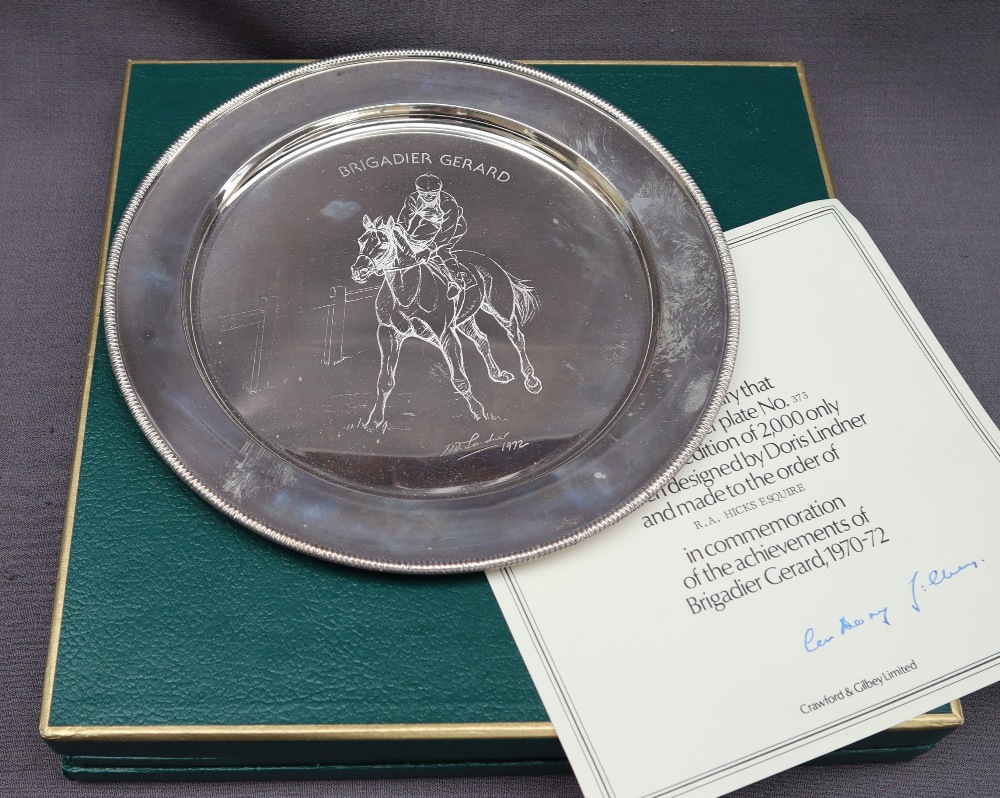 An Elizabeth II silver plate designed by Doris Lindner in commemoration of the achievements of