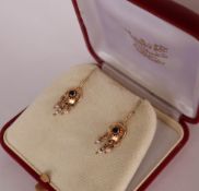 A pair of 14ct gold earrings with seed pearl drops,