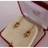 A pair of 14ct gold earrings with seed pearl drops,