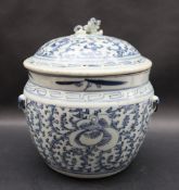 A Chinese porcelain pot and cover, the domed lid with lion dog finial,