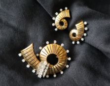 An 18ct gold and diamond set brooch,