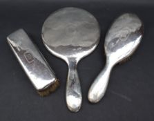 Tiffany & Co sterling silver backed three piece dressing table set, comprising a hand mirror,