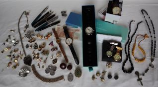 Assorted costume jewellery including talking watches, brooches, necklaces, pens, cufflinks,