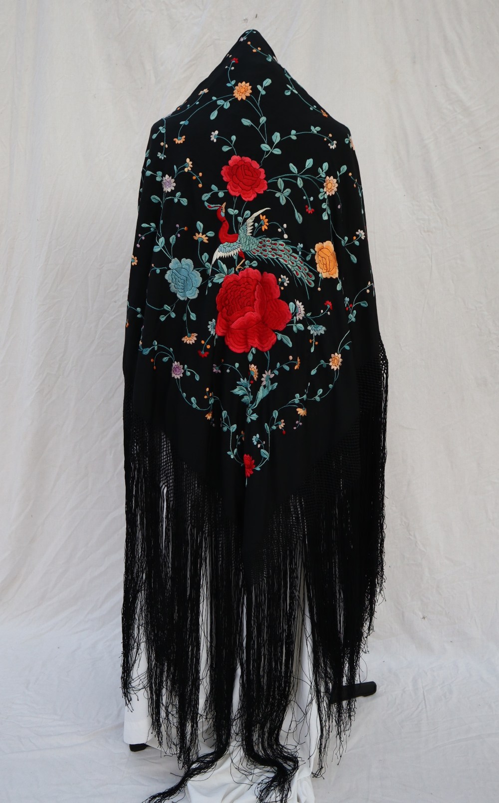 A silk piano shawl, the black ground profusely embroidered with peacocks, - Image 3 of 16