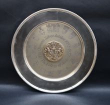 An Elizabeth II silver dish with central raised gilt roundel,