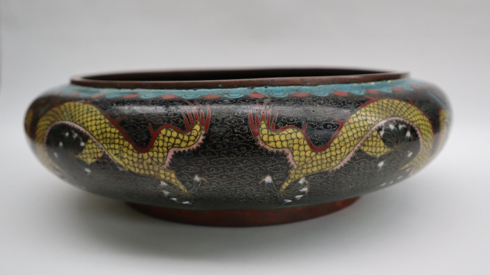 A Japanese cloisonne enamel bowl, decorated to the centre with a dragon to a black cloud ground, - Image 4 of 9