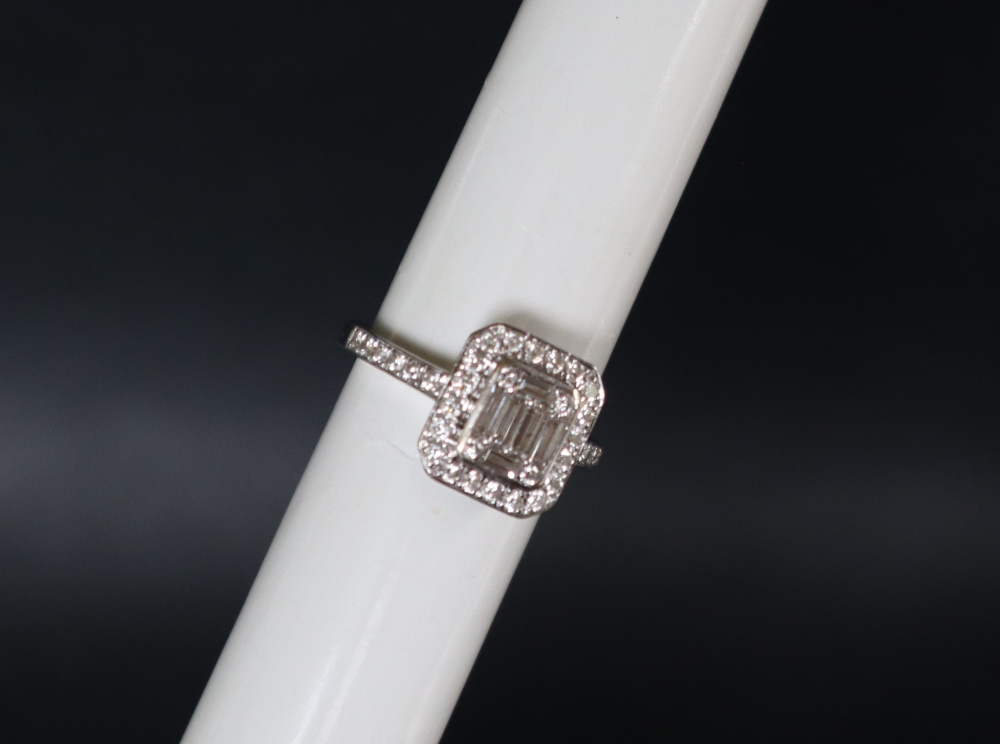 An 18ct white gold diamond cluster ring set with baguette and round brilliant cut diamonds to the - Image 2 of 7