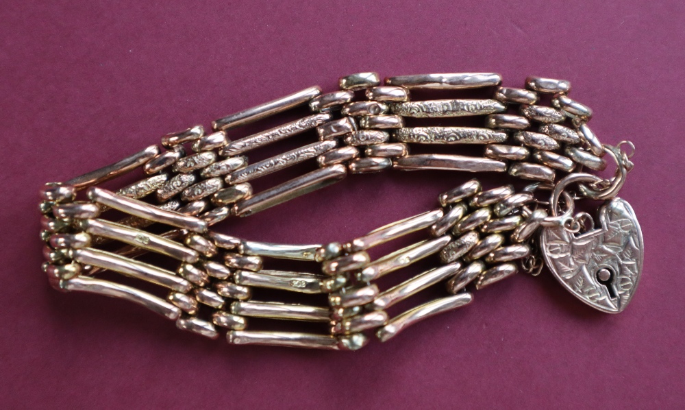 A 9ct gold gate bracelet, set with four bars to a padlock clasp, approximately 16. - Image 3 of 4