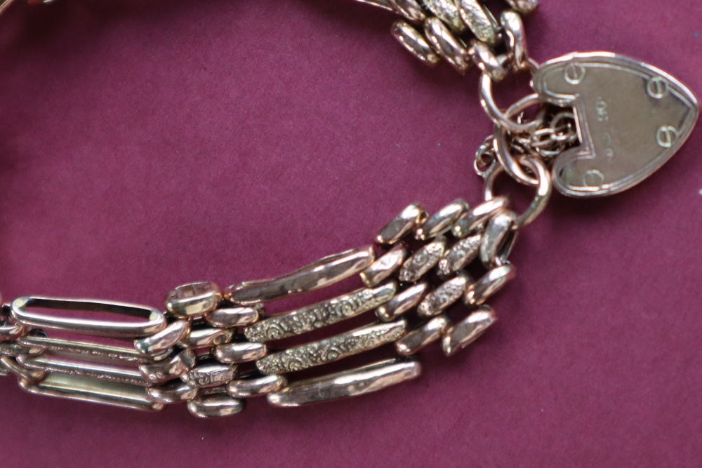 A 9ct gold gate bracelet, set with four bars to a padlock clasp, approximately 16. - Image 2 of 4