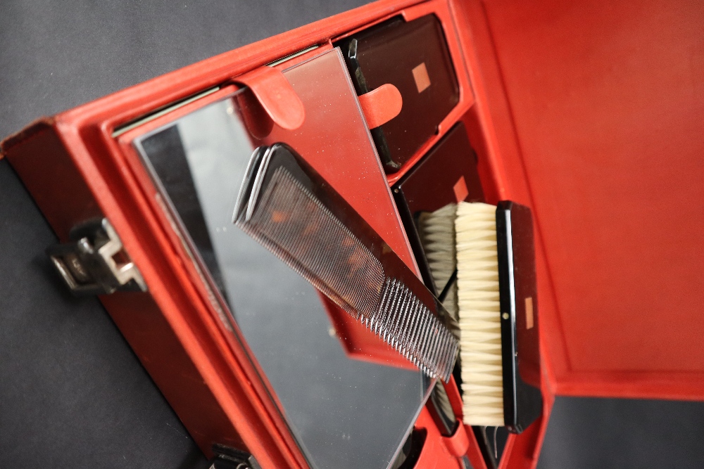 S T Dupont, a red leather travelling case fitted with two brushes, three bottles, easel mirror, - Image 12 of 20