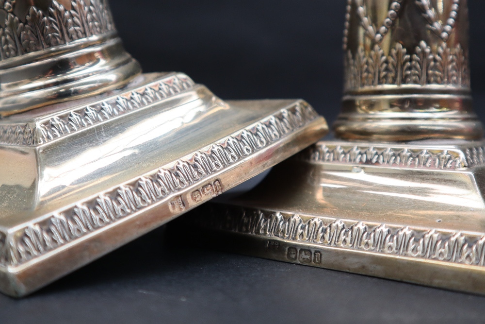 A pair of George V silver corinthian column candlesticks, - Image 2 of 2
