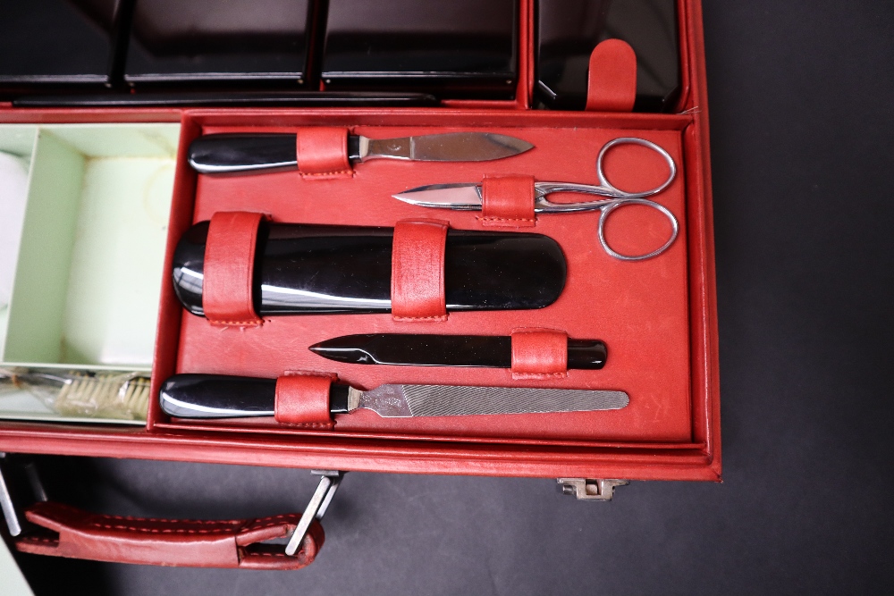 S T Dupont, a red leather travelling case fitted with two brushes, three bottles, easel mirror, - Image 5 of 20