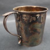 A George V silver christening mug with a leaf capped scrolling handle, inscribed Richard, Sheffield,