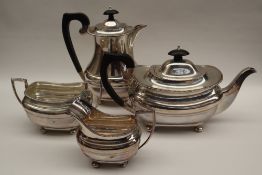 A George VI silver four piece tea set, comprising a teapot, hot water pot,