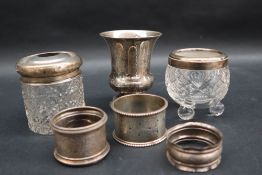 A continental white metal flared beaker on a spreading foot,