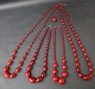 A string of cherry amber / bakelite beads,