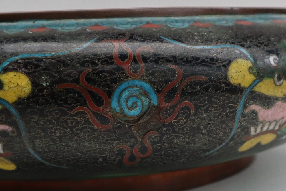 A Japanese cloisonne enamel bowl, decorated to the centre with a dragon to a black cloud ground, - Image 7 of 9