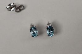 A pair of Aquamarine and diamond drop earrings,