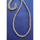 An 18ct yellow and white gold rope twist necklace, 71cm long,