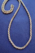 An 18ct yellow and white gold rope twist necklace, 71cm long,