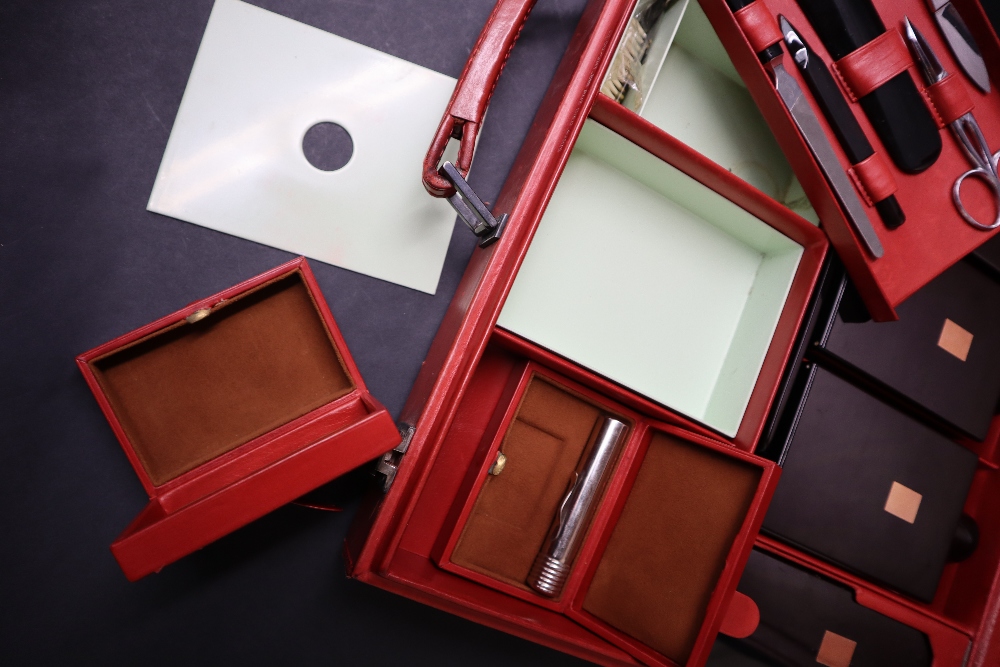 S T Dupont, a red leather travelling case fitted with two brushes, three bottles, easel mirror, - Image 7 of 20