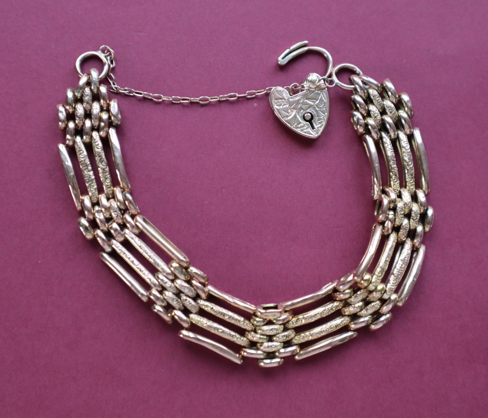 A 9ct gold gate bracelet, set with four bars to a padlock clasp, approximately 16. - Image 4 of 4