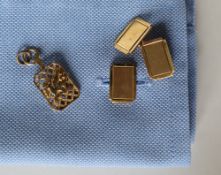 A pair of 9ct yellow gold cufflinks, of rectangular form with engine turned decoration,