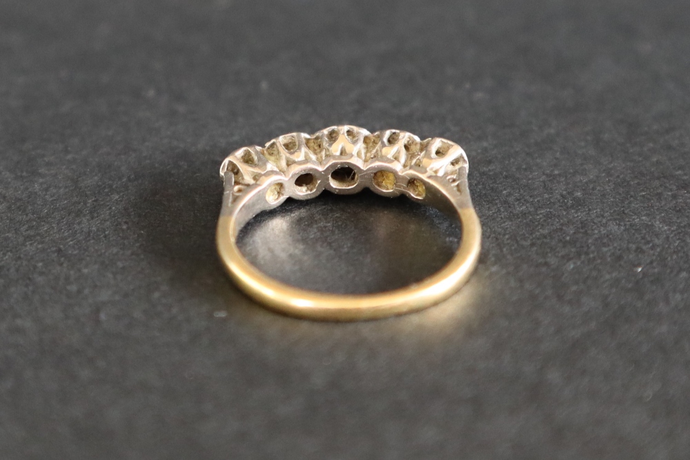 A five stone diamond ring set with graduated old cut diamonds to a white metal setting and 18ct - Image 5 of 7