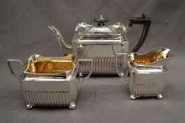 A late Victorian silver three piece tea set,
