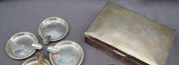 A George V silver cigarette box of rectangular form with engine turned decoration, 17 x 11cm,
