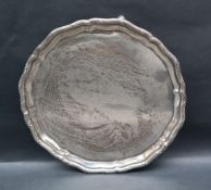 A George V Silver Salver with a line and cross rim, on three scrolling feet, Sheffield, 1916,