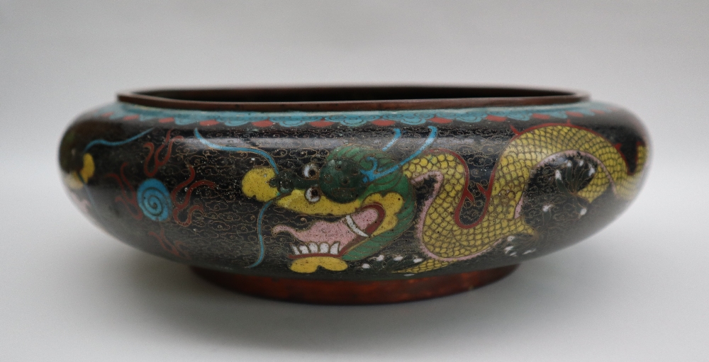 A Japanese cloisonne enamel bowl, decorated to the centre with a dragon to a black cloud ground, - Image 5 of 9