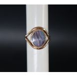A 9ct gold ring, set with an oval opal panel, size M, approximately 5.