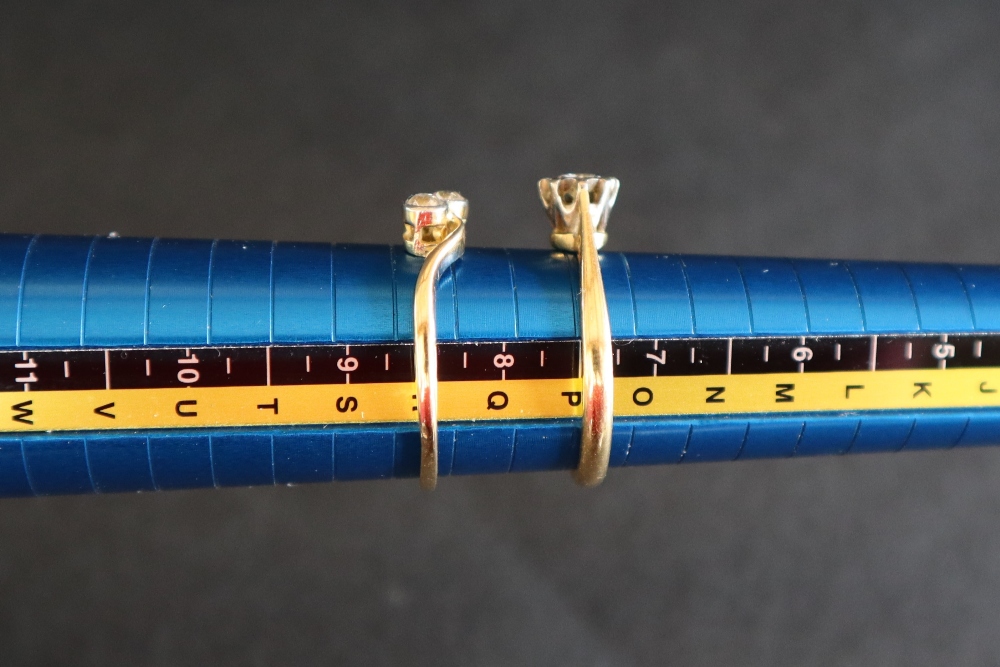 A solitaire diamond ring, set with around faceted diamond to an 18ct gold shank, - Image 4 of 4