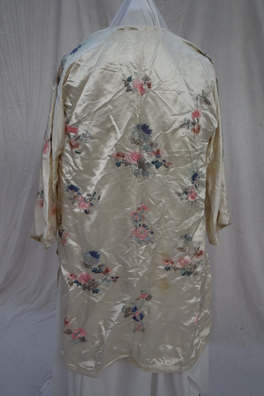 A Japanese silk kimono, the cream ground embroidered with roses and chrysanthemums, - Image 2 of 4