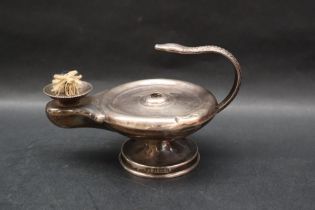 An Asprey & Co silver cigar lighter in the form of an oil lamp with a snake handle on a spreading