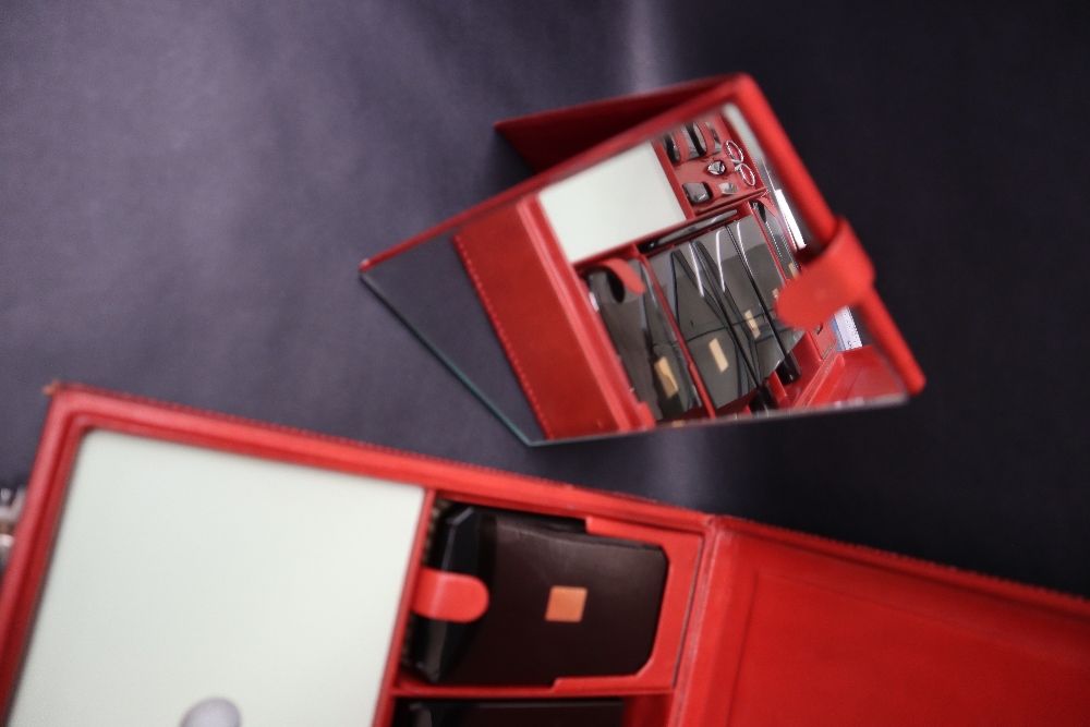 S T Dupont, a red leather travelling case fitted with two brushes, three bottles, easel mirror, - Image 3 of 20