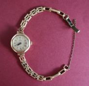 A lady's 9ct yellow gold lady's Pilot wristwatch, with a circular dial,