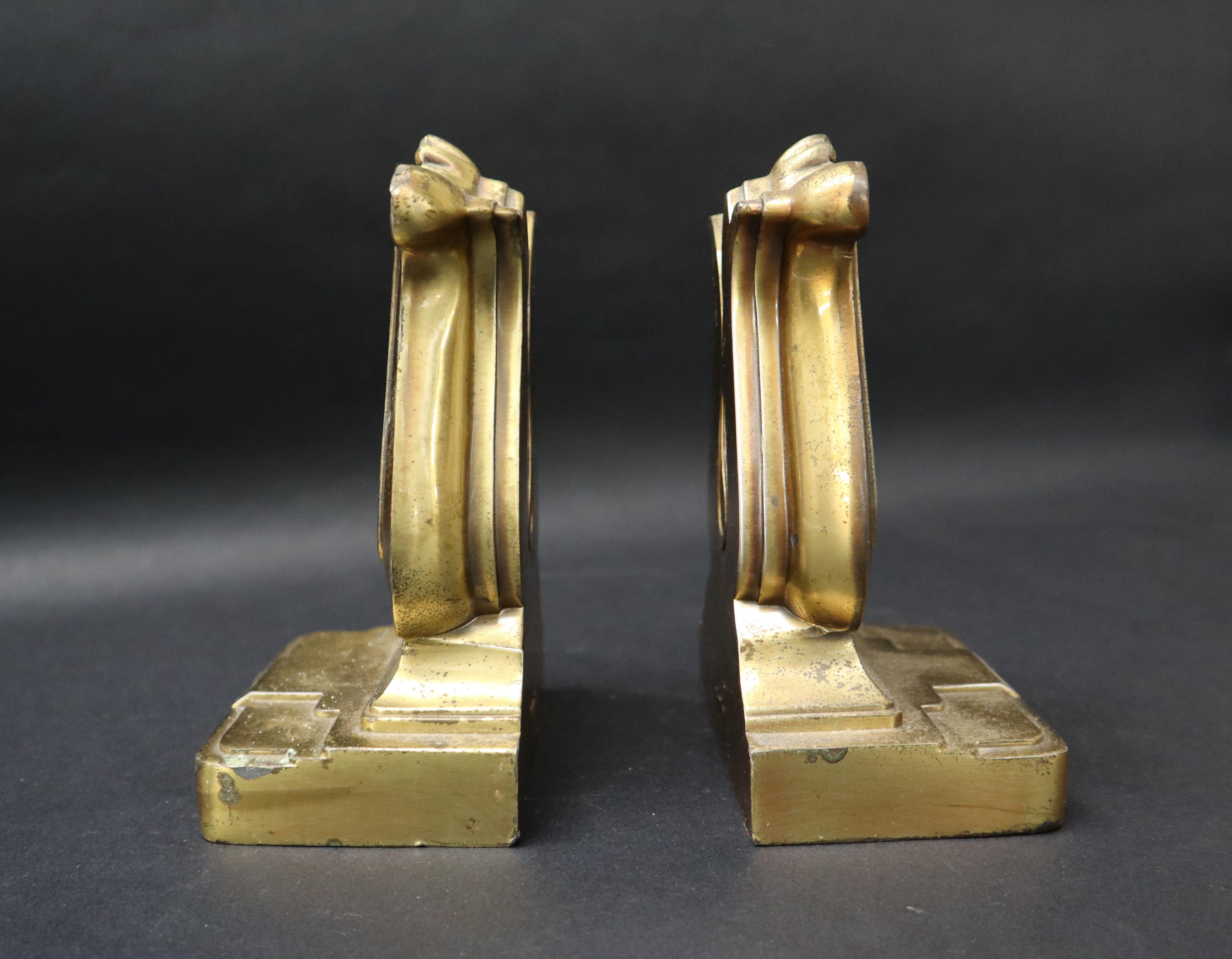 A pair of bronze book ends in the form of lyres on a rectangular base, moulded 56B PMC, - Image 3 of 6