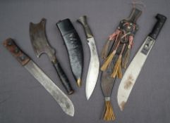 A curved Kukri dagger with a turned wooden metal mounted grip,
