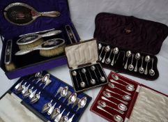 A George V Silver and tortoiseshell dressing table set comprising two clothes brushes,