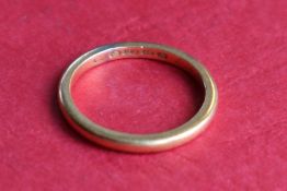 A 22ct gold wedding band, size P 1/2,