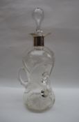 An Edward VII silver topped and glass decanter,