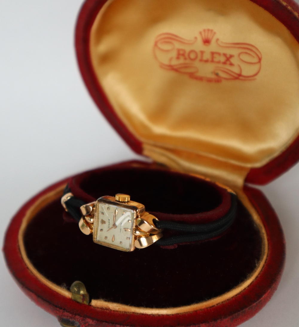 A lady's 18ct gold Rolex wristwatch, the square dial with dot markers, marked Rolex Precision,