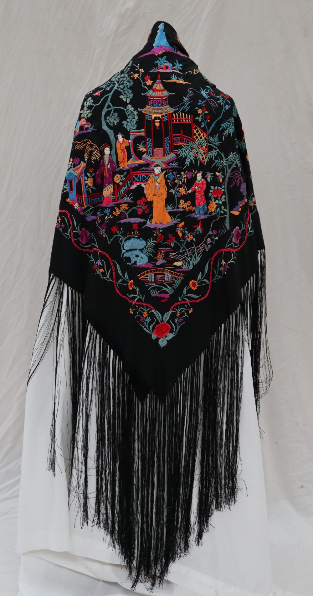 A black silk piano shawl with repeat hand embroidered design of figures in traditional dress - Image 2 of 9