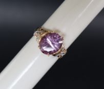 An amethyst and diamond and dress ring,