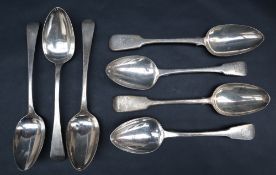 A collection of seven George III silver table spoons,