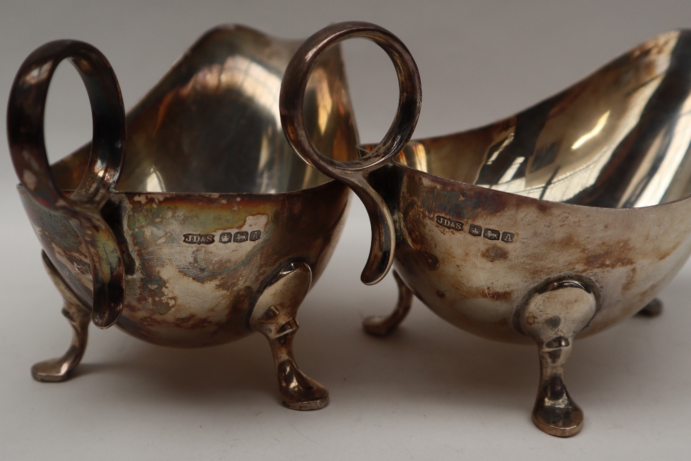 A pair of George VI silver sauce boats of usual form with ring handle and three legs with pointed - Image 2 of 4