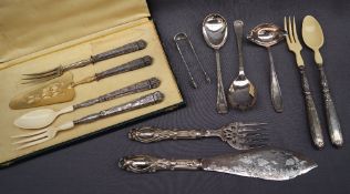 A continental white metal part serving set, comprising salad servers with bakelite ends,